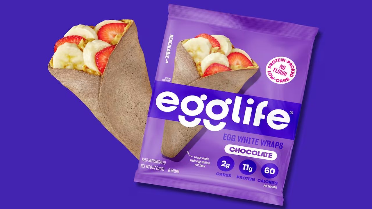 Egglife chocolate egg white wraps package beside a wrap filled with strawberries and banana