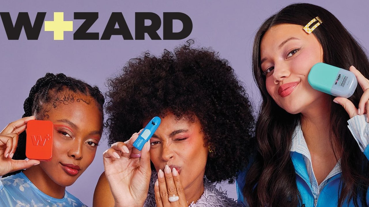 Three people holding Wizard Wellness nasal care products under the brand's logo