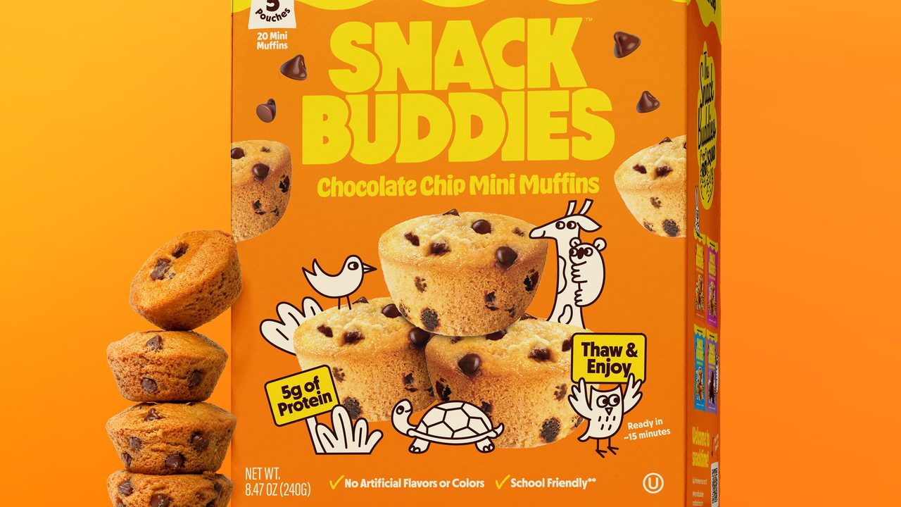 A box of Snack Buddies chocolate chip mini muffins with muffins stacked beside it